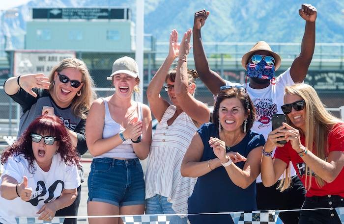 (Rick Egan  |  The Salt Lake Tribune)      Alta High teachers cheer for their students as the parade of 2020 graduates drive by in a “drive through” graduation ceremony at Alta High, Thursday, May 28, 2020.