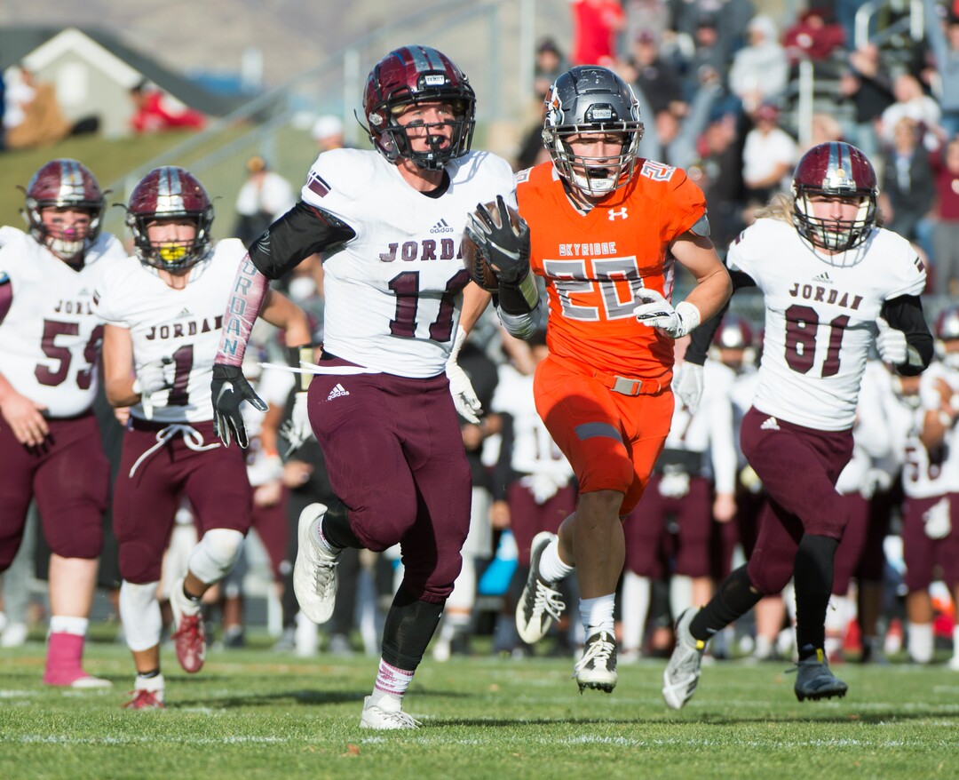 (Rick Egan  |  The Salt Lake Tribune)   Jordan running back Jake Shaver (11) runs for a touchdown, in prep 5A playoff action between Jordan High and Skyridge High, in Lehi, Friday, Nov. 2, 2018.