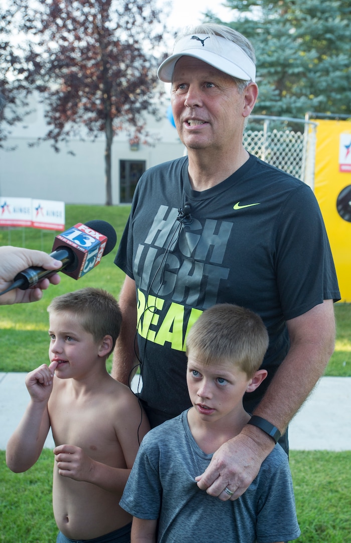 (Rick Egan  |  The Salt Lake Tribune)  Danny Ainge, talks to the media, with his grandson's Oliver, 8 and Oscar 10, at a fundraiser in Provo for his son Tanner Ainge, who is running for congress, in Utah’s third district. Monday, August 7, 2017.