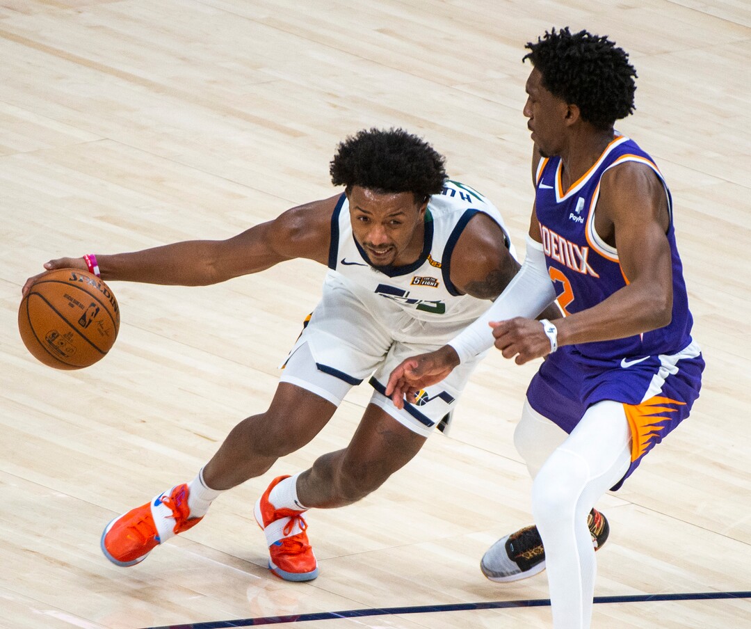 (Rick Egan | The Salt Lake Tribune)  Utah Jazz forward Elijah Hughes (33) drives as Phoenix Suns guard Langston Galloway (2) defends, in preseason NBA action between Utah Jazz and Phoenix Suns at Vivint SmartHome Area, on Saturday, Dec. 12, 2020.
