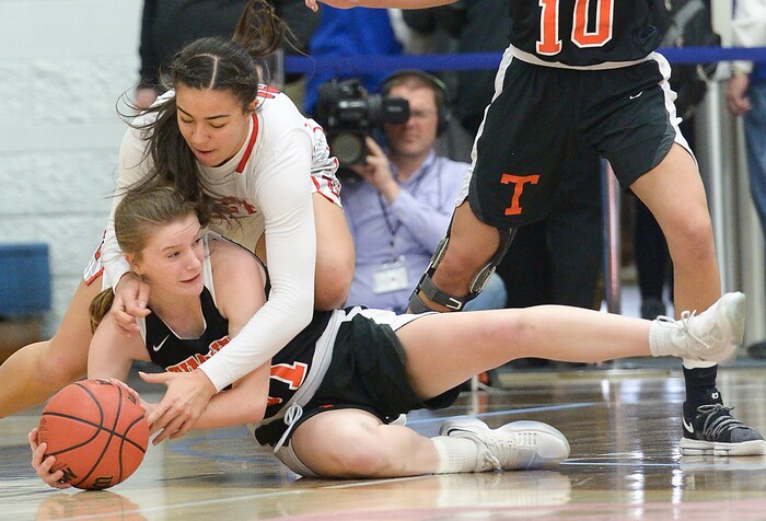 (Leah Hogsten  |  The Salt Lake Tribune) Timpview's Taylor Ross (31) battles East's Liana KaituÕu (23) for a loose ball.  East faces Timpview in the championship game of the 5A High School Girls' Basketball Tournament at SLCC in Taylorsville, Saturday, Feb. 24, 2018.