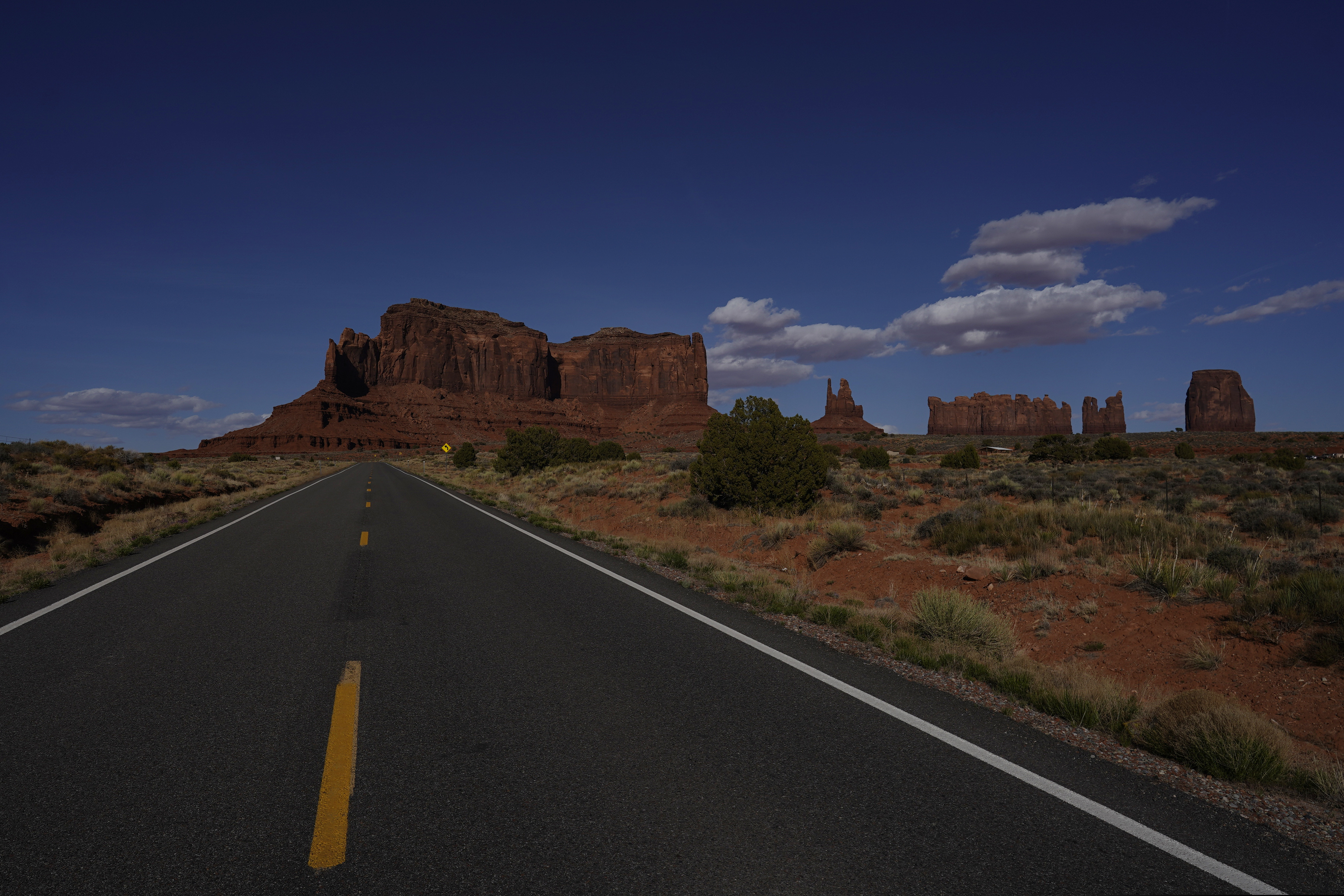 This April 23, 2020 photo shows an empty Interstate 163 in Oljato-Monument Valley, Utah, on the Navajo reservation. To help prevent the spread of COVID-19, the Navajo Monument Vally Tribal Park is closed. (AP Photo/Carolyn Kaster)