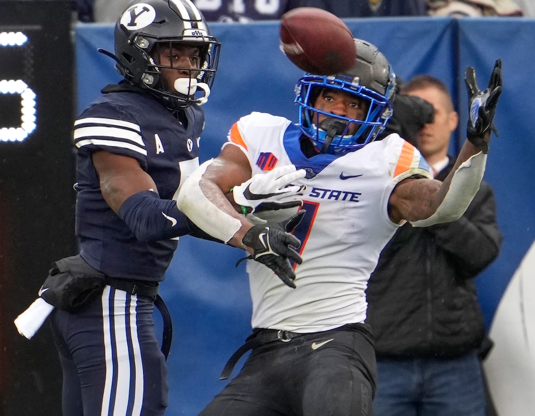 (Leah Hogsten | The Salt Lake Tribune) Boise State Broncos wide receiver Octavius Evans (1) pulls in the pass defended by Brigham Young Cougars defensive back D'Angelo Mandell (5) as No. 10 Brigham Young University hosts Boise State at LaVell Edwards Stadium, Oct. 9, 2021.