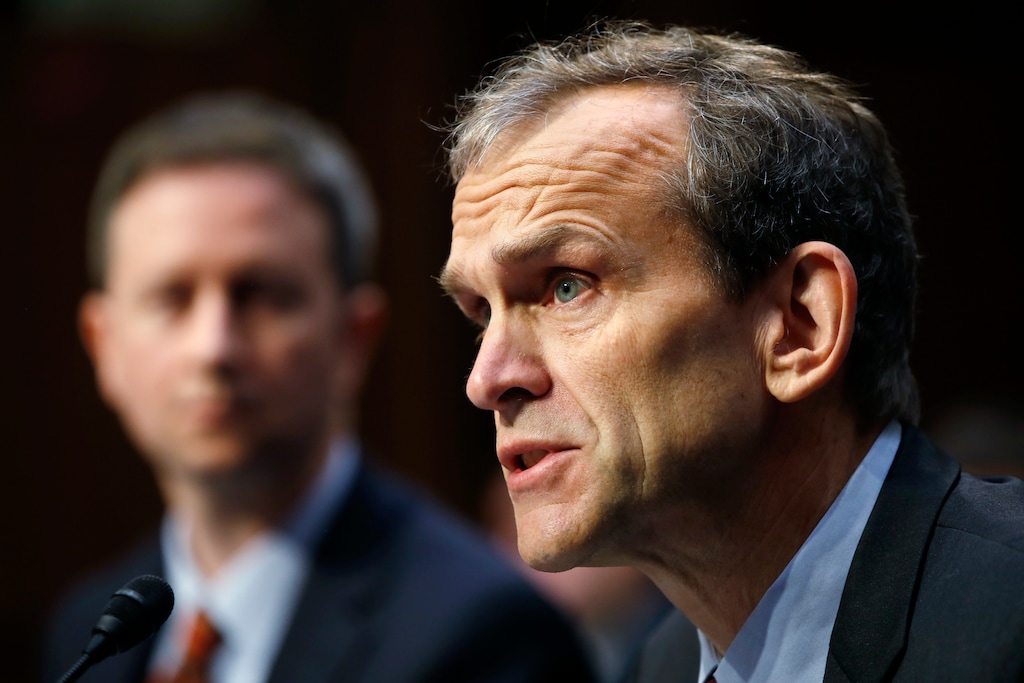 Google's Senior Vice President and General Counsel Kent Walker, right, speaks during a Senate Intelligence Committee hearing on Russian election activity and technology, Wednesday, Nov. 1, 2017, on Capitol Hill in Washington. At left is Twitter's Acting General Counsel Sean Edgett. (AP Photo/Jacquelyn Martin)