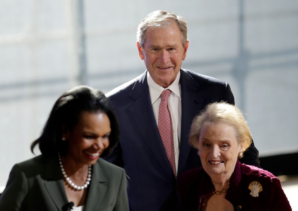 Former U.S. President George W. Bush greets former U.S. Secretary of State  Condoleezza Rice, left, and Madeleine Albright, right, after they participated in a panel discussion at a forum sponsored by the George W. Bush Institute in New York, Thursday, Oct. 19, 2017. (AP Photo/Seth Wenig)