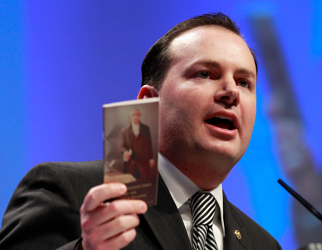 Sen. Mike Lee, R-Utah, holds up a copy of the Constitution as he speaks at the Conservative Political Action Conference (CPAC) in Washington, Friday, Feb. 11, 2011.(AP Photo/Alex Brandon)