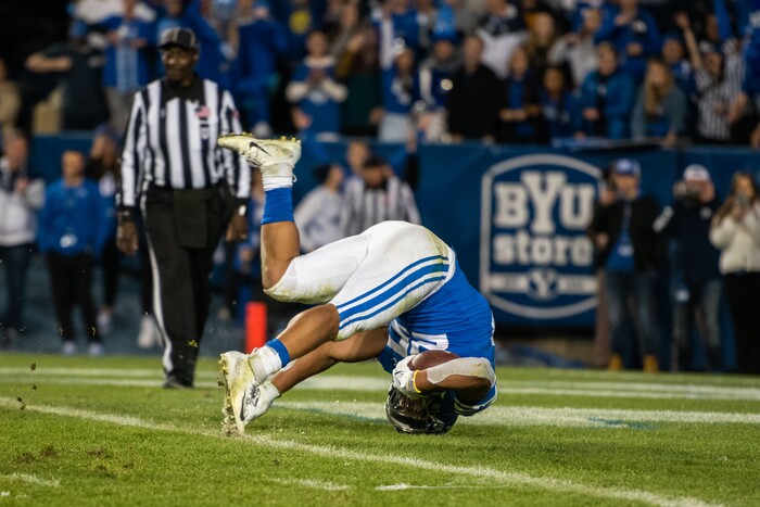 (Trevor Christensen | Special to The Tribune) Brigham Young University's Tyler Allgeier performs a somersault into the end zone against Virginia during the second half at LaVell Edwards Stadium on Saturday, Oct. 30, 2021, in Provo.