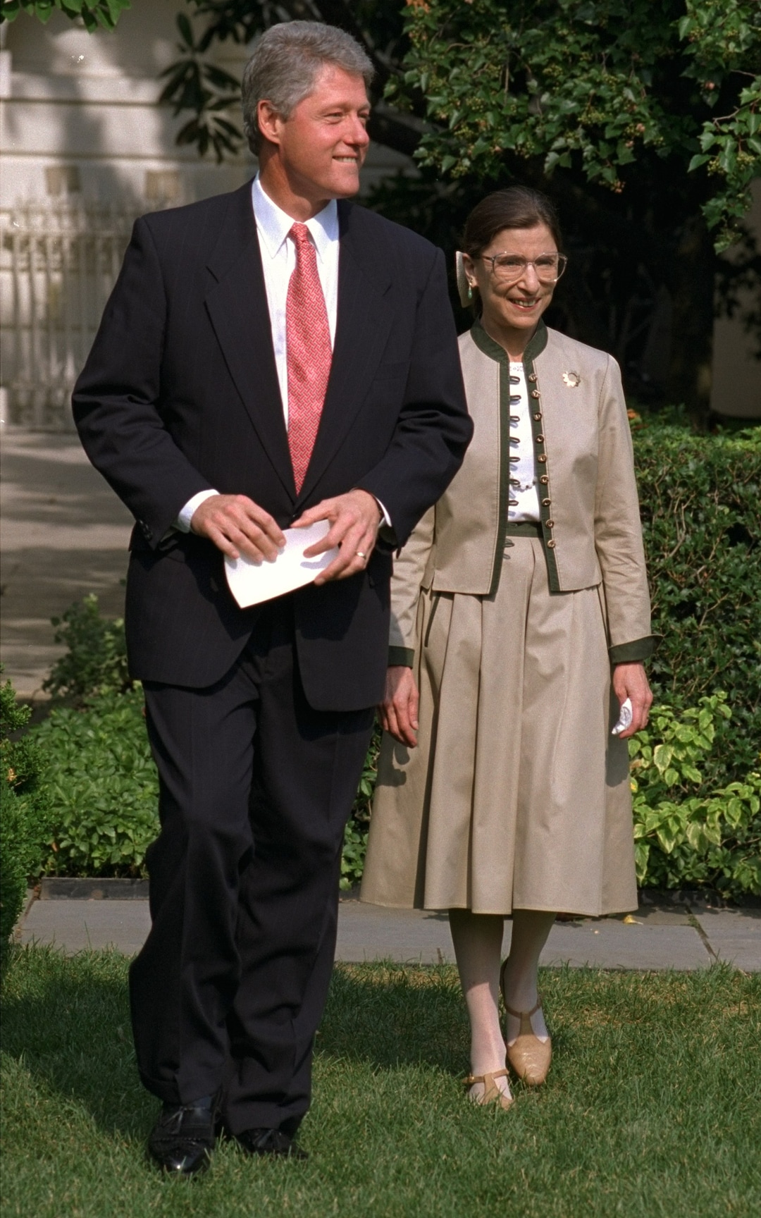 President Clinton and Judge Ruth Bader Ginsburg walk to the Rose Garden of the White House Tuesday August 3, 1993 to meet with reporters.  Earlier, the Senate voted 96-3 to confirm Ginsburg to the Supreme Court, making her the second woman to serve on the high court.  (AP Photo/Ron Edmonds)