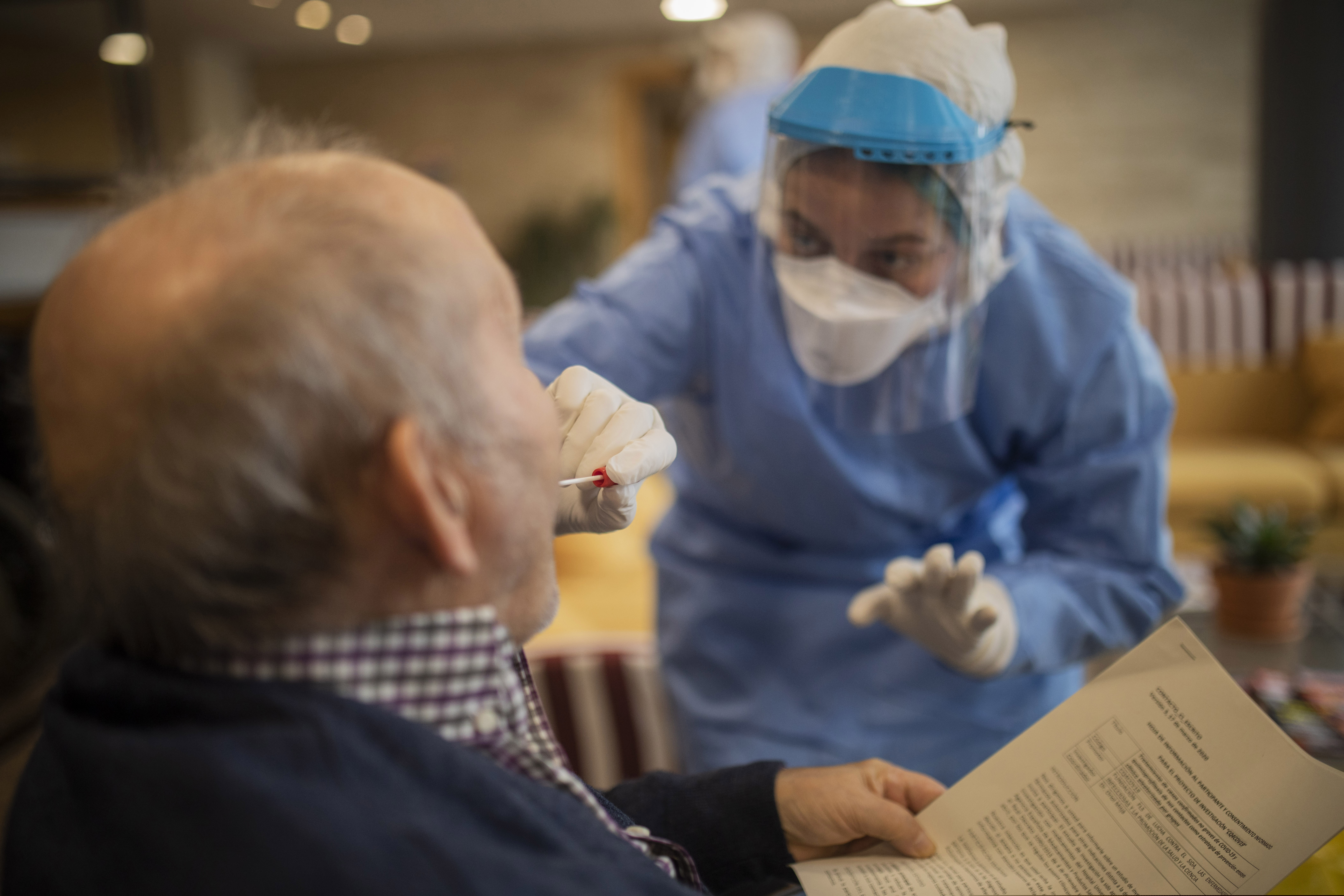 (Santi Palacios  |  AP file photo) Aid workers from the Spanish NGO Open Arms carry out coronavirus detection tests on the elderly at a nursing home in Barcelona, Spain, on Wednesday, April 1, 2020.