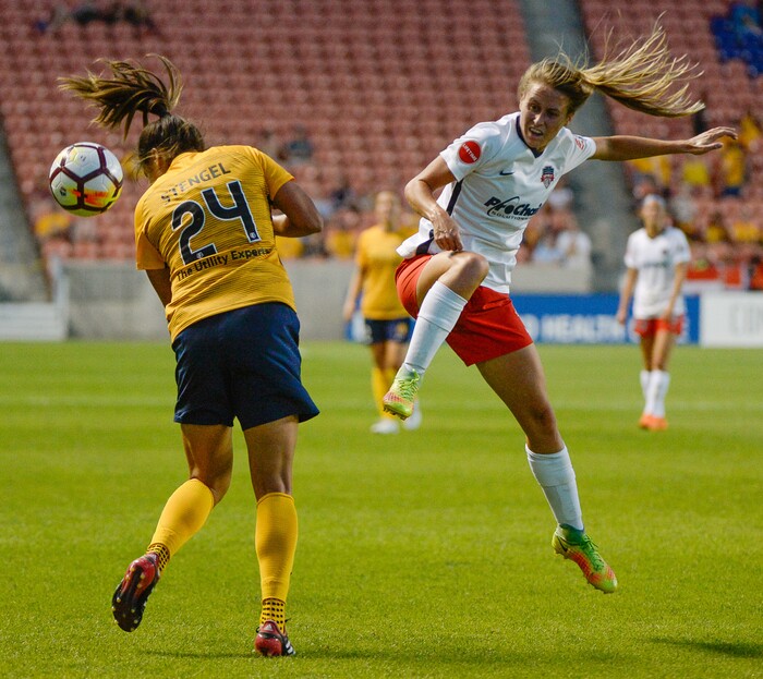 (Francisco Kjolseth  |  The Salt Lake Tribune)  Utah Royals FC hosts Washington Spirit, NWSL soccer at Rio Tinto Stadium in Sandy, Wed. Aug. 8, 2018. Utah Royals FC forward Katie Stengel (24) collides with Washington Spirit forward Mallory Eubanks (22) following a header attempt in the first half of the game. 