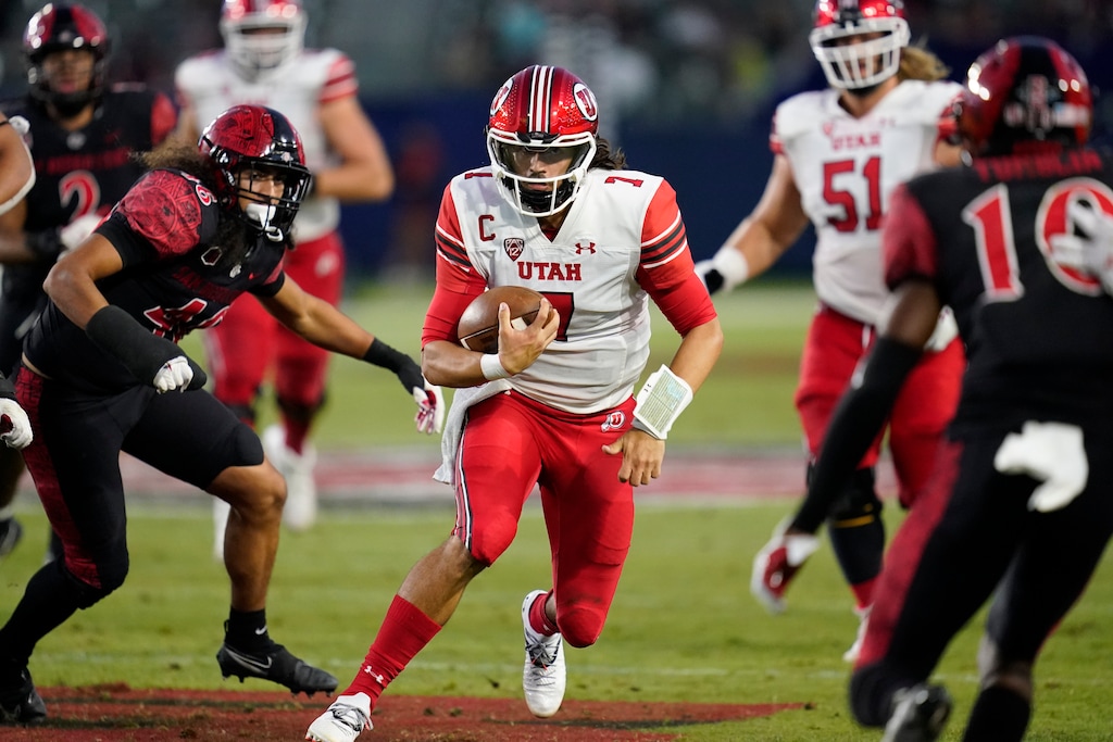 (Ashley Landis | AP) Utah quarterback Cameron Rising (7) runs the ball during the second half of an NCAA college football game against San Diego State Saturday, Sept. 18, 2021, in Carson, Calif.