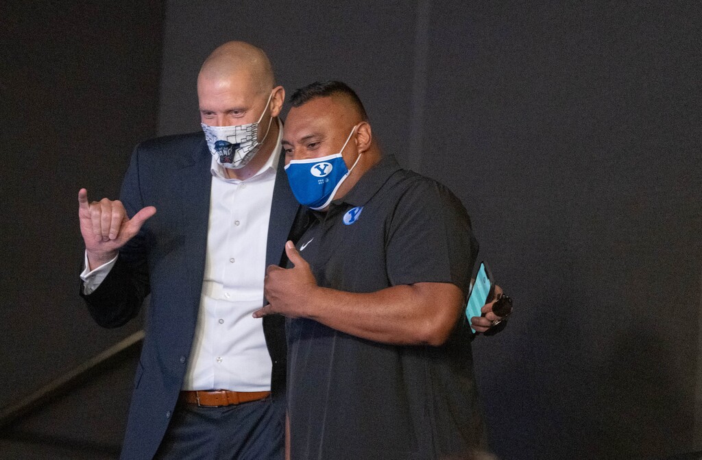 (Francisco Kjolseth | The Salt Lake Tribune) Brigham Young University basketball coach Mark Pope, left, poses for a photo alongside BYU football coach Kalani Sitake as they attend the announcement of BYU's acceptance into the Big 12 conference at a press conference in Provo, Friday, Sept. 10, 2021.