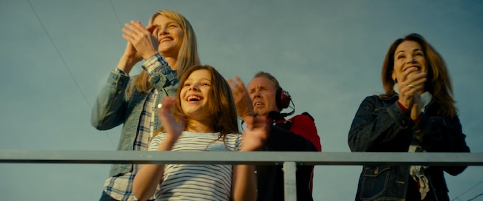 (photo courtesy Freestyle Releasing) Amber (Lindsay Pulsipher, left), with her daughter Bree (Makenzie Moss) and mother-in-law Patti (Kim Delaney) watch a stock-car race with Joe (Gary Grubbs, background), a racing coach, in the drama "God Bless the Broken Road."