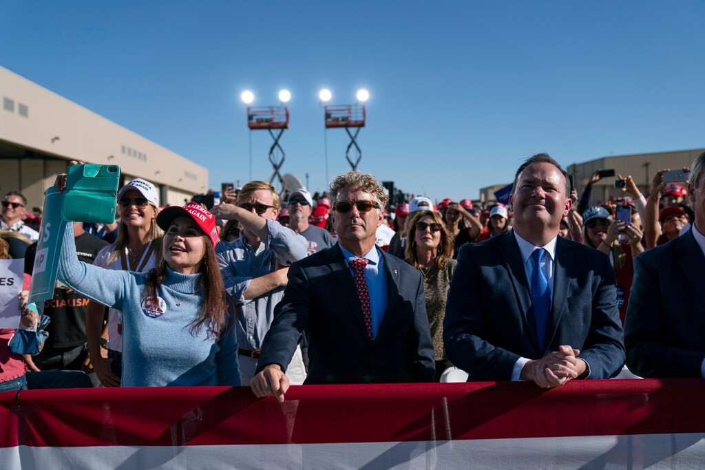 (Evan Vucci | AP file photo)  Sen. Rand Paul, R-Ky., center, and Sen. Mike Lee, R-Utah, listen with other supporters as President Donald Trump speaks during a campaign rally at Phoenix Goodyear Airport, Wednesday, Oct. 28, 2020, in Goodyear, Ariz.
