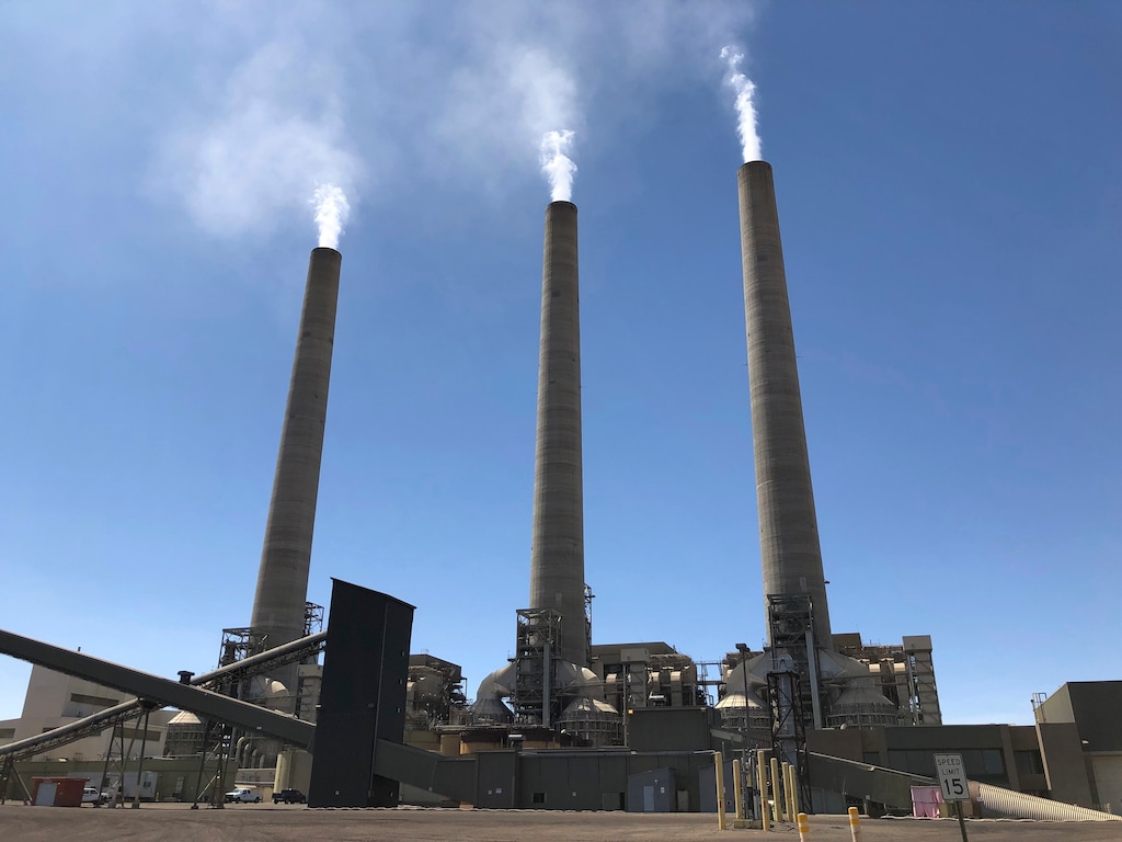 (Susan Montoya Bryan | AP file photo) This Aug. 20, 2019, image shows a trio of concrete stacks at the Navajo Generating Station near Page, Ariz.