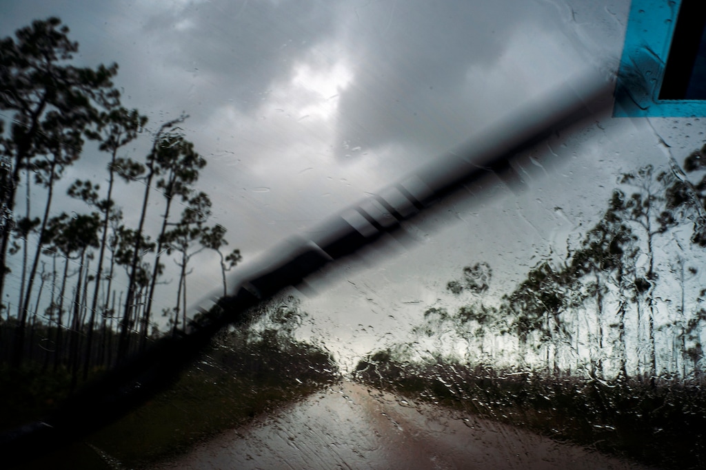 (AP Photo/Ramon Espinosa) A car returns to the capital under the previous rain before the arrival of Hurricane Dorian in Freeport, Grand Bahama, Bahamas, Sunday Sept. 1, 2019.