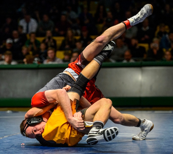 (Steve Griffin  |  The Salt Lake Tribune) Brock Hardy, of Box Elder, drives Brad Lowery, of Canyon View, to the mat during the All-Star Duals wrestling at Utah Valley University's UCCU Center in Orem Tuesday January 9, 2018.