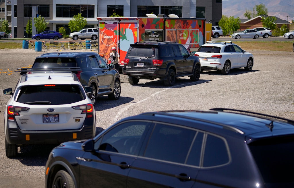 (Bethany Baker  |  The Salt Lake Tribune) Customers line up in the drive-thru at Tossd, a new food truck, in Vineyard on Wednesday, May 1, 2024.