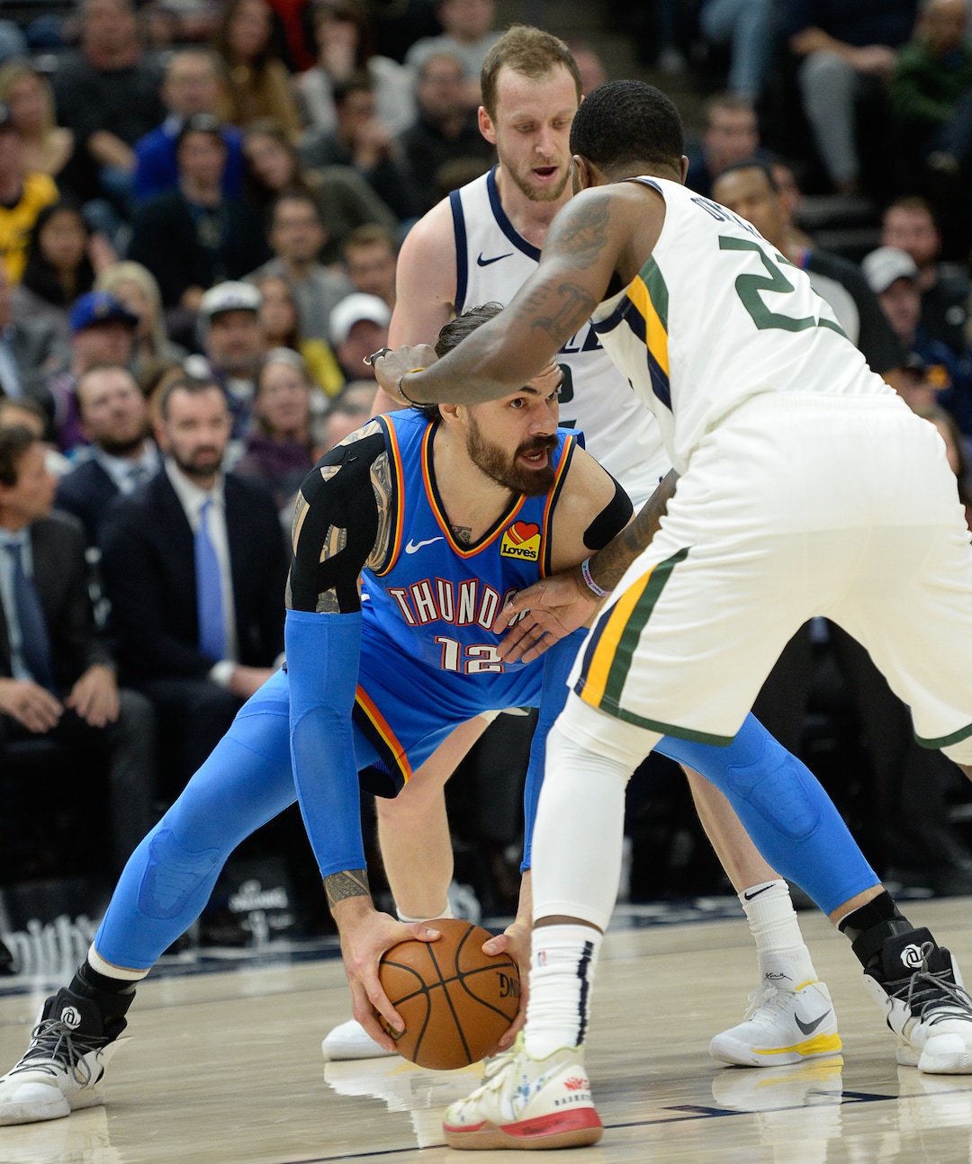(Francisco Kjolseth  |  The Salt Lake Tribune)  Oklahoma City Thunder center Steven Adams (12) is pressured by Utah Jazz forward Royce O'Neale (23) as the Utah Jazz host the Oklahoma City Thunder in their NBA basketball game at Vivint Smart Home Arena in Salt Lake City on Mon. Dec. 9, 2019.