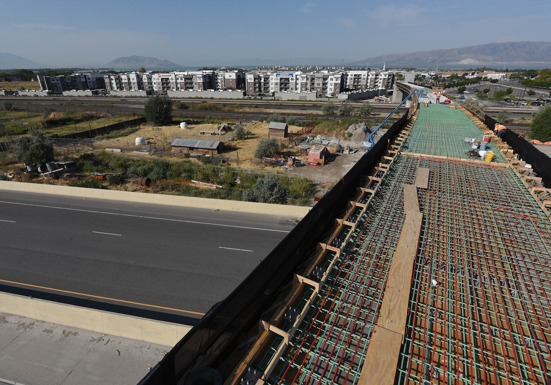 (Francisco Kjolseth  |  The Salt Lake Tribune) UDOT gives a tour of the state’s new longest pedestrian bridge on Thursday, August 20, 2020, connecting Utah Valley University in Orem to student housing and the community on the West side of I-15. Crews are finishing up an extensive hydronic heating system that will pump warm water to keep the bridge clear of snow in the winters, as it gets ready to pour concrete for the walking surface. UDOT will close I-15 in both directions this weekend for work on the nearly 1,000 foot bridge that is 15 feet wide to accommodate pedestrians, cyclists and scooters. Elevators and stairs with small ramps to push up bicycles will be on each side of the bridge.