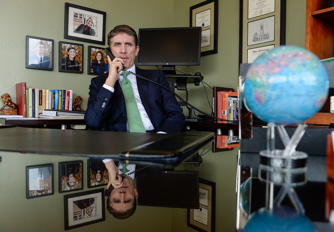 (Francisco Kjolseth  |  The Salt Lake Tribune)  Utah Valley University President Matthew S. Holland takes a news radio interview on Monday, Nov. 6, 2017, following his announced calling as an LDS mission president. Holland's last day as UVU president will be in early June of 2018. 