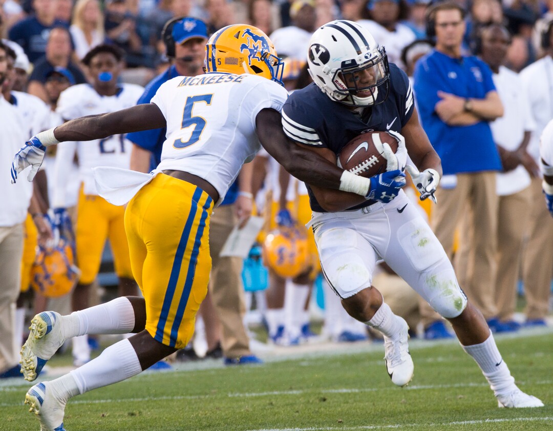 (Rick Egan  |  The Salt Lake Tribune)    Brigham Young Cougars wide receiver Aleva Hifo (15) tries to get by McNeese State Cowboys defensive back Jovon Burriss (5), in football action Brigham Young Cougars vs McNeese State Cowboys at Lavell Edwards Stadium, Saturday, Sept. 22, 2018.