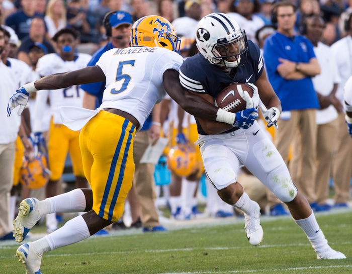(Rick Egan  |  The Salt Lake Tribune)    Brigham Young Cougars wide receiver Aleva Hifo (15) tries to get by McNeese State Cowboys defensive back Jovon Burriss (5), in football action Brigham Young Cougars vs McNeese State Cowboys at Lavell Edwards Stadium, Saturday, Sept. 22, 2018.


