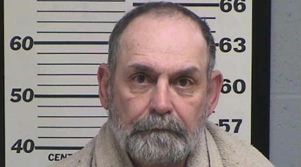 (Photo courtesy Millard County Jail) John Peck has been arrested for investigation of murder in the shooting death of his brother.