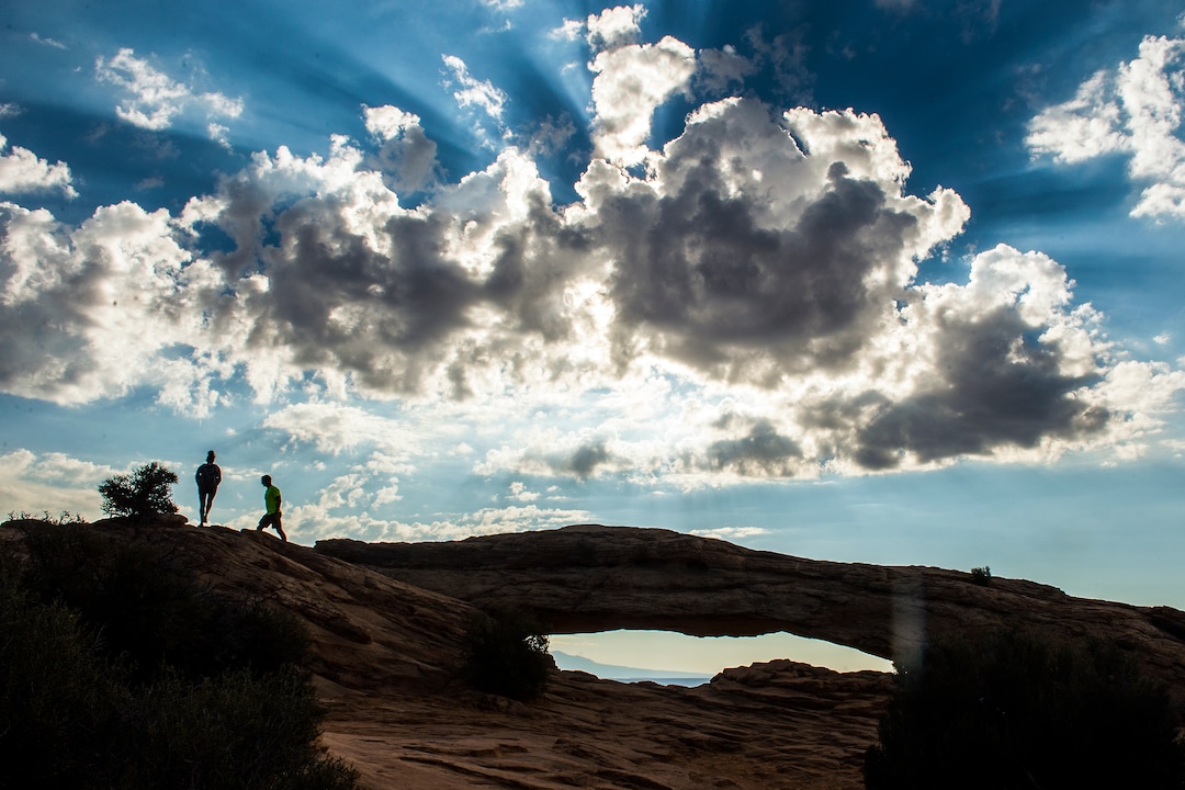 (Chris Detrick | The Salt Lake Tribune) Visitors walk around Mesa Arch in the Island in the Sky District at Canyonlands National Park Thursday August 25, 2016.