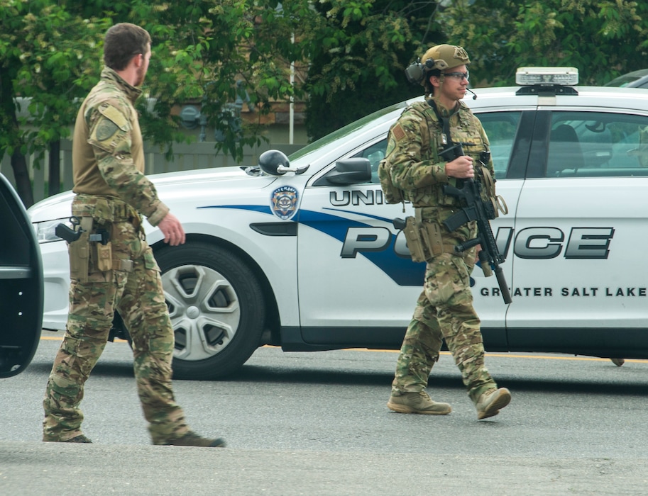 (Rick Egan  |  The Salt Lake Tribune) Unified Police Swat team members leave an apartment complex after a domestic violence call in Midvale. Friday May 1, 2020