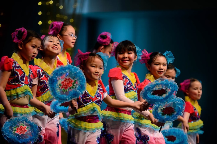 (Trent Nelson | The Salt Lake Tribune)  Dancers from Salt Lake Chinese Dance Arts perform a fan dance at the Chinese New Year Celebration at the County Library's Viridian Event Center in West Jordan, Saturday Feb. 17, 2018.