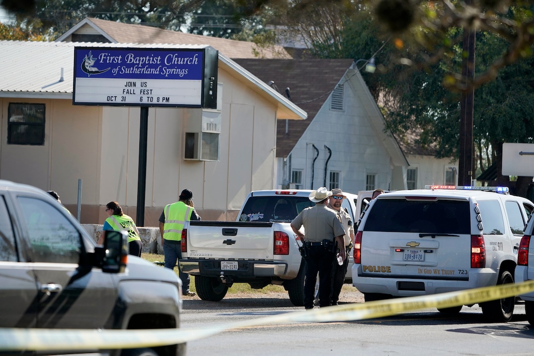 (Darren Abate | The Associated Press) Law enforcement officers gather in front of the First Baptist Church of Sutherland Springs after a fatal shooting, Sunday, Nov. 5, 2017, in Sutherland Springs, Texas.
