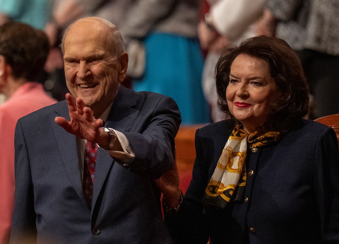(Rick Egan | The Salt Lake Tribune) President Russel M. Nelson waves to the audience with his wife, Wendy, after the morning session of LDS General Conference on Saturday, April 2, 2022.
