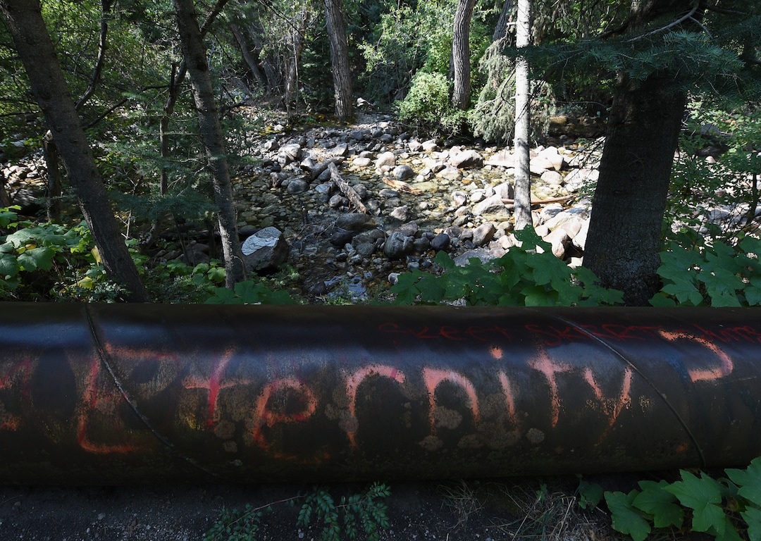 (Francisco Kjolseth  |  The Salt Lake Tribune)  Graffiti has proliferated in lower Little Cottonwood Canyon, where vandals, often wielding cans of fluorescent-colored spray paint, have covered granite faces, trees and structures. The vandalism is particularly apparent along the Temple Quarry Trail and the creek at the Moon Rock swimming hole and former pavilion site. Volunteers using donated equipment and solvents spend thousands of hours removing the paint from the rocks only to see graffiti return to the same faces or on rock nearby.