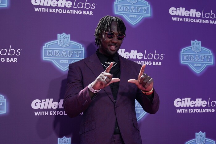Utah linebacker Devin Lloyd poses on the red carpet during the first round of the NFL football draft Thursday, April 28, 2022, in Las Vegas. (AP Photo/Jae C. Hong )