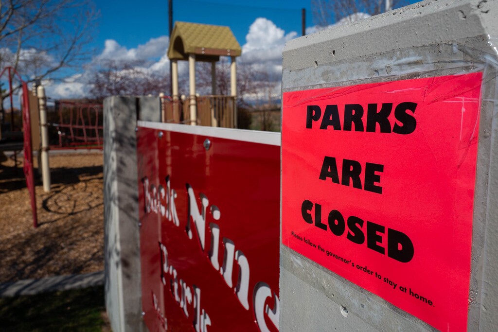 (Trent Nelson | The Salt Lake Tribune) A sign saying parks are closed at West Valley City's Back Nine Park, sen on Thursday, April 2, 2020. As many as 1.9 million Utahns are now under some kind of county-mandated order to shelter in place, limit travel and other activities and maintain social distancing due to the coronavirus outbreak.