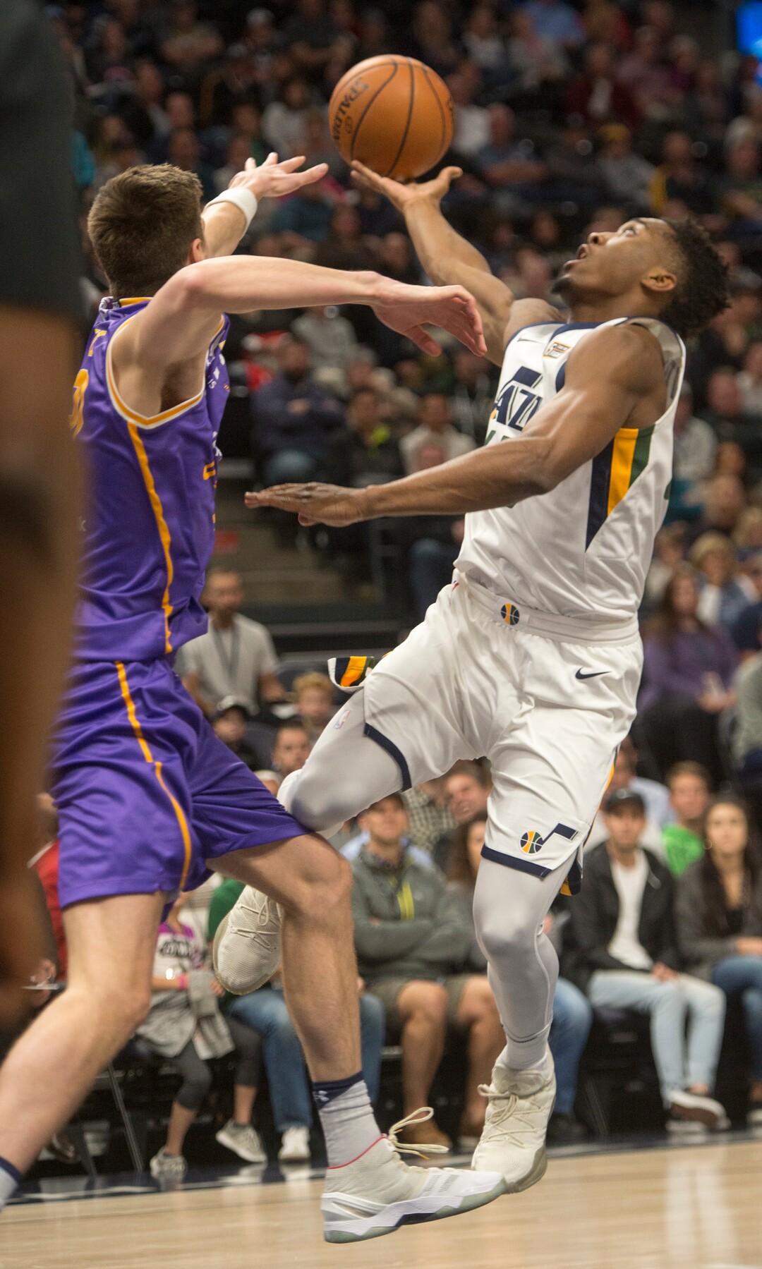 (Rick Egan  |  The Salt Lake Tribune)  Utah Jazz guard Donovan Mitchell (45) goes up for a shot, as Sydney Kings forward Dane Pineau (22) defends, in preseason basketball Utah Jazz vs.Sydney Kings, in Salt Lake City, Sunday, October 2, 2017.