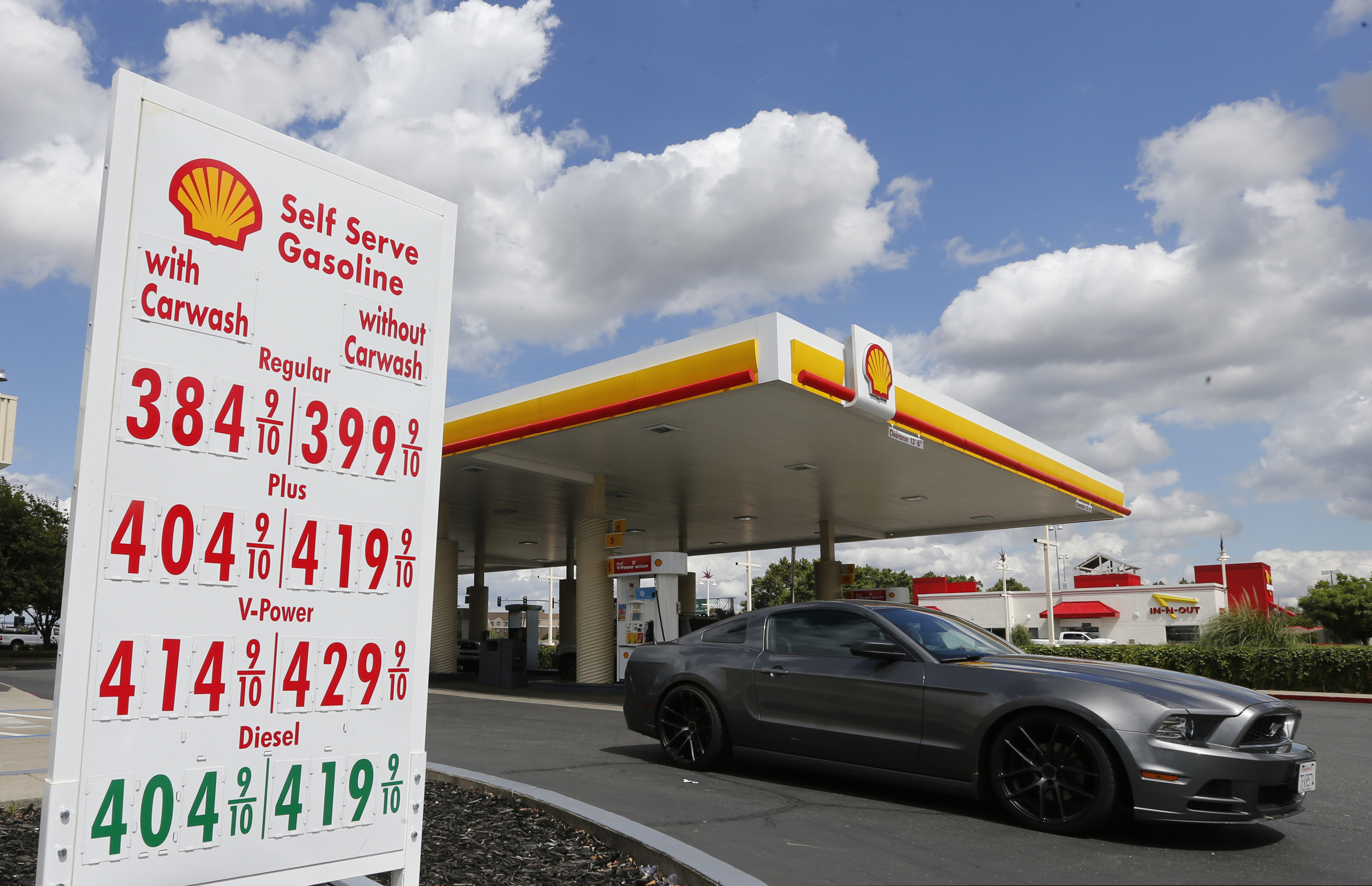 (Rich Pedroncelli | AP file photo)  A car leaves a Shell station after getting gas in Sacramento, Calif., on May 17, 2019.