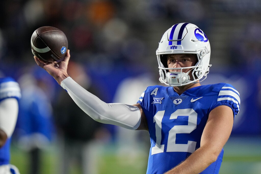 (Francisco Kjolseth | The Salt Lake Tribune) Brigham Young Cougars quarterback Jake Retzlaff (12) warms up before their game against the Oklahoma State Cowboys in Provo on Friday, Oct. 18, 2024.