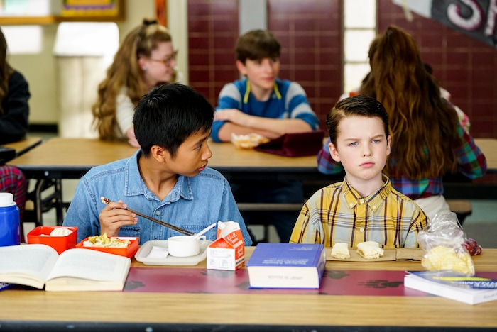 (Photo: Robert Voets/Warner Bros.) Tam (Ryan Phuong) and Sheldon (Iain Armitage) work on a model rocket on “Young Sheldon.”