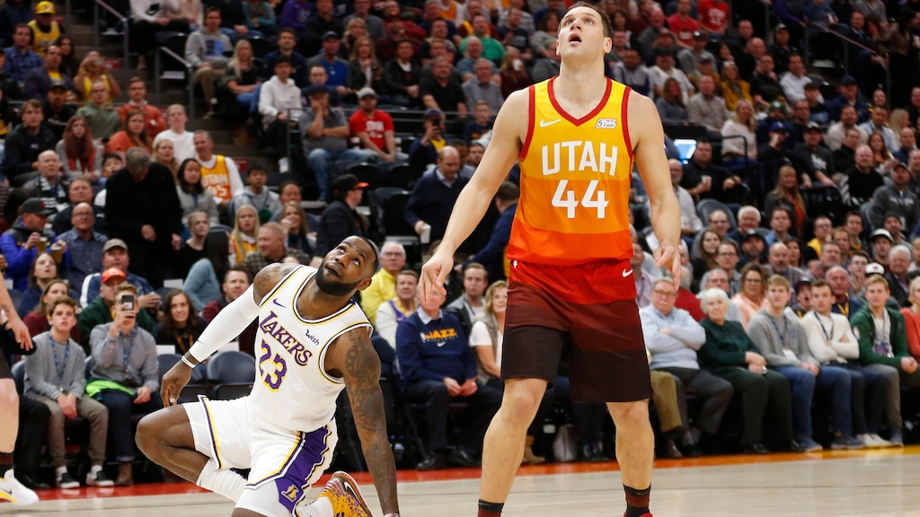 Los Angeles Lakers forward LeBron James (23) and Utah Jazz forward Bojan Bogdanovic (44) wait on a rebound in the first half during an NBA basketball game Wednesday, Dec. 4, 2019, in Salt Lake City. (AP Photo/Rick Bowmer)