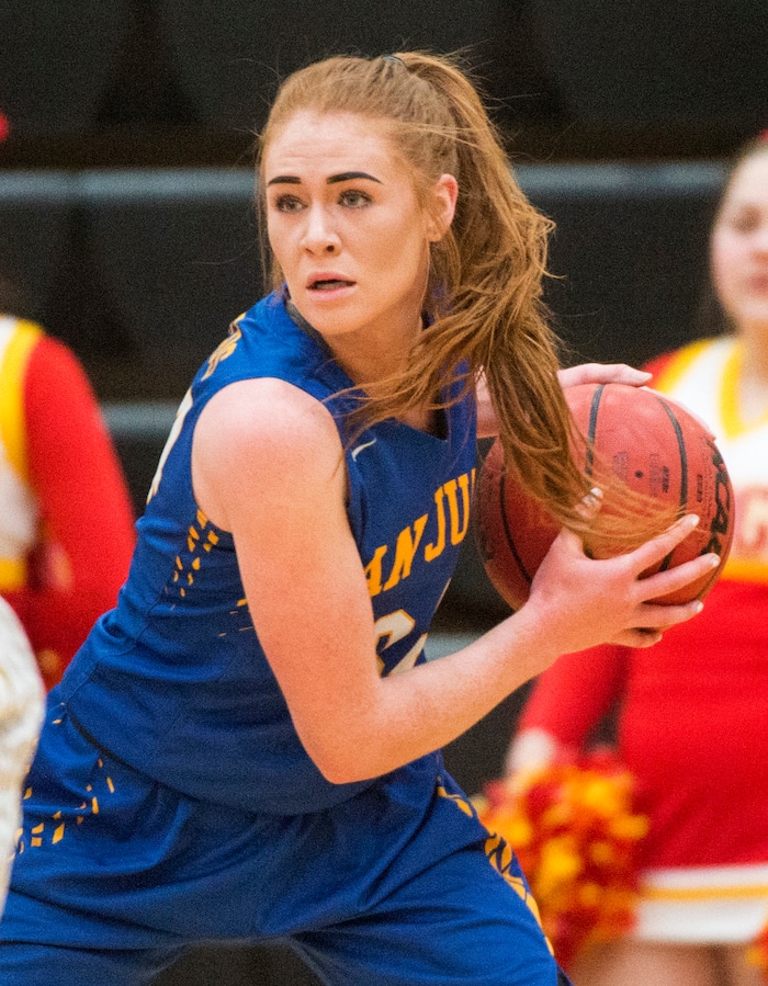 (Rick Egan  |  The Salt Lake Tribune)    Delaney Palmer, (34) grabs a rebound for an Juan, in 3A Women's basketball playoff action Judge Memorial vs. San Juan, in Heber City, Friday, Feb. 16, 2018.