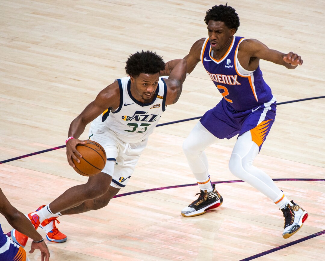 (Rick Egan | The Salt Lake Tribune)  Utah Jazz forward Elijah Hughes (33) drives as Phoenix Suns guard Langston Galloway (2) defends, in preseason NBA action between Utah Jazz and Phoenix Suns at Vivint SmartHome Area, on Saturday, Dec. 12, 2020.