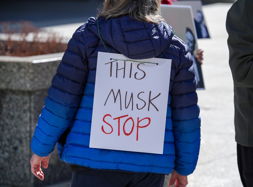 (Chris Samuels | The Salt Lake Tribune) People participate in a protest against Elon Musk and the Trump administration outside the Wallace F. Bennett Federal Building in Salt Lake City, Wednesday, Feb. 26, 2025.