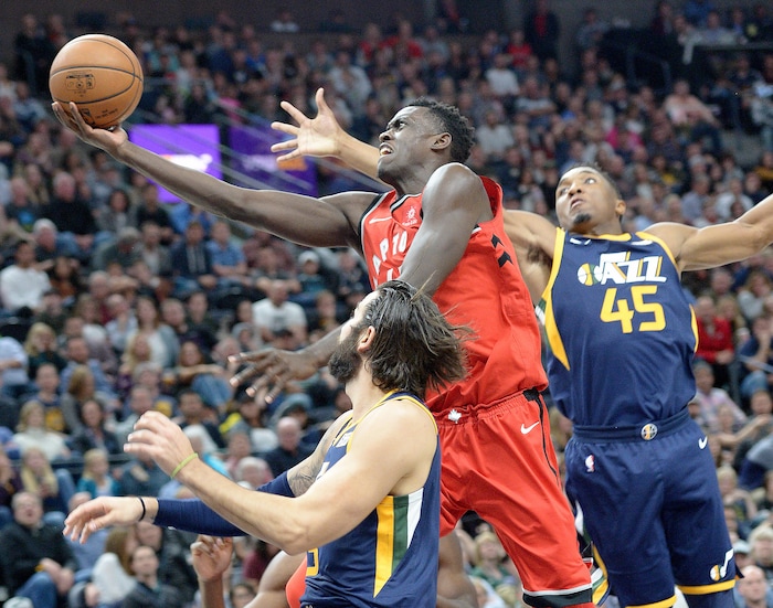 (Leah Hogsten  |  The Salt Lake Tribune)Toronto Raptors forward Pascal Siakam (43) drives to the net around Utah Jazz guard Ricky Rubio (3) and Utah Jazz guard Donovan Mitchell (45). The Utah Jazz were defeated by the Toronto Raptors 100-109 at Vivint Smart Home Arena, Friday, November 3, 2017