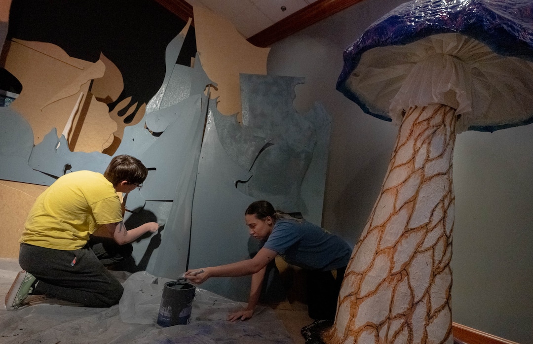 (Francisco Kjolseth | The Salt Lake Tribune) Artists Clay Greenall, left, and Ryenne Garcia paint portions of crystal castle facade of Dreamscapes, an immersive experience transformed by artists that promotes sustainability and uses almost exclusively up cycling materials, begins to take shape in the old Macy's at South Town on Wednesday, April 20, 2022. 