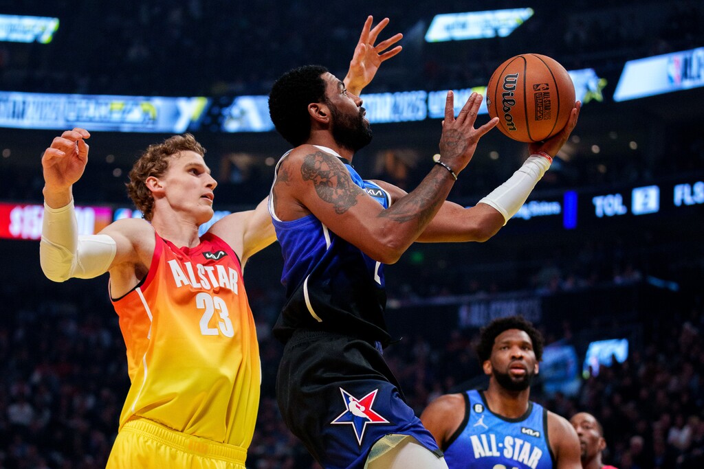 (Trent Nelson  |  The Salt Lake Tribune) Kyrie Irving drives past Lauri Markkanen at the NBA All-Star Game in Salt Lake City on Sunday, Feb. 19, 2023.