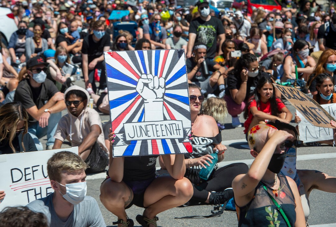 (Rick Egan  |  The Salt Lake Tribune)  Marchers pause in the street as they listen to speeches during a Juneteenth march in the streets of Salt Lake City, Friday, June 19, 2020.