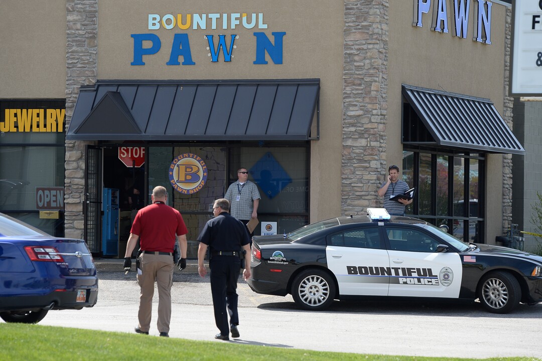 (Francisco Kjolseth  |  The Salt Lake Tribune)  Police work the scene of a shooting at Pawn and Sales, 135 S. and 500 West, in Bountiful on Friday, May 4, 2018, where two men attempted to rob the store. One suspect was killed in a "scuffle" with a staff member while the other one fled the scene.