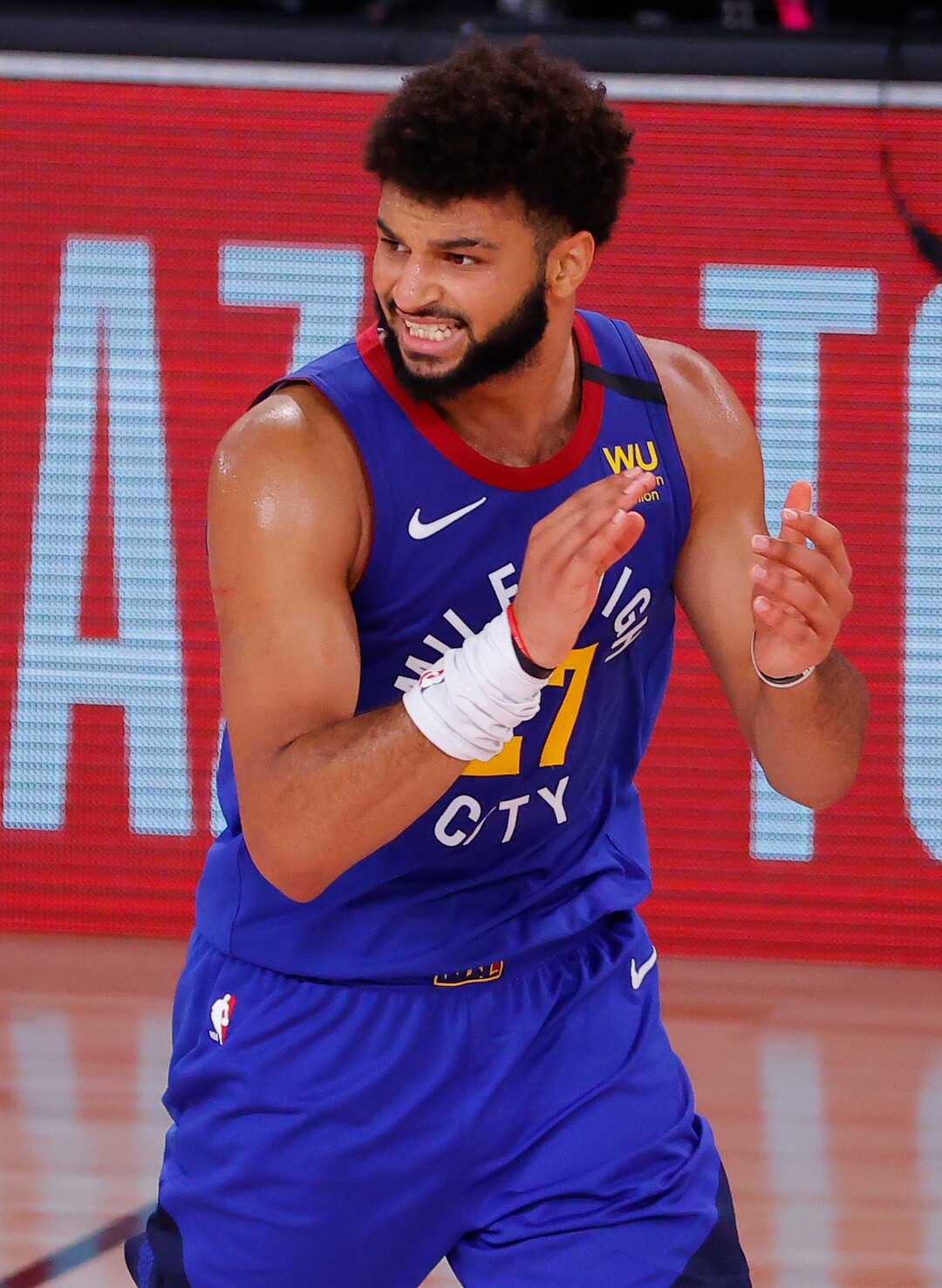 Denver Nuggets' Jamal Murray celebrates a 3-point basket against the Utah Jazz during the fourth quarter of Game 4 of an NBA basketball first-round playoff series, Sunday, Aug. 23, 2020, in Lake Buena Vista, Fla. (Kevin C. Cox/Pool Photo via AP)